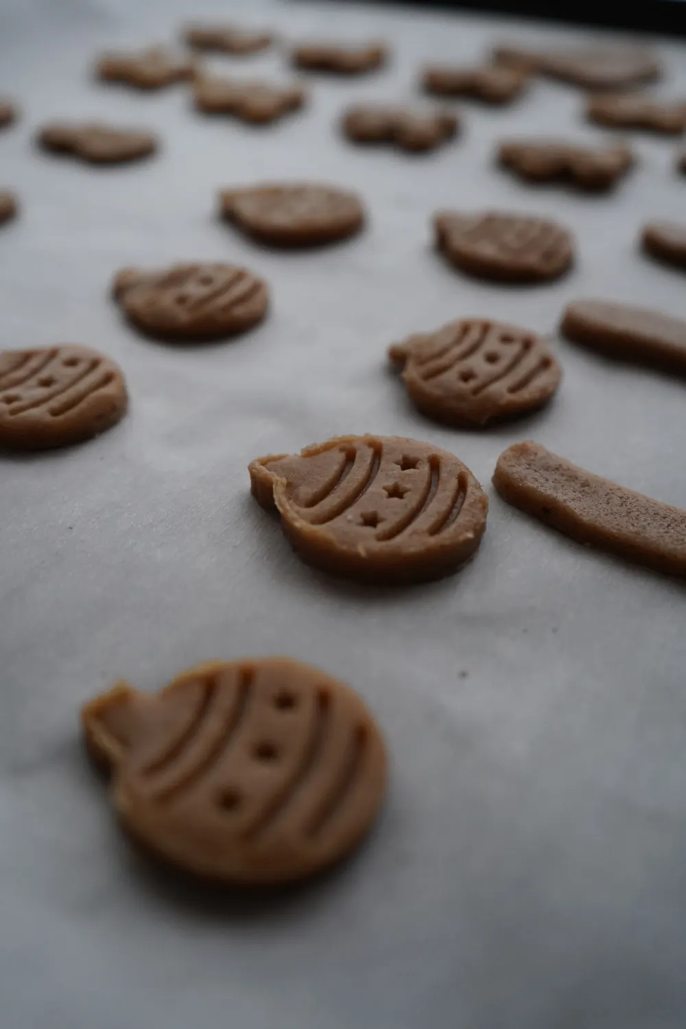 Holiday-themed cookie dough cutouts ready for baking, perfect for festive occasions.