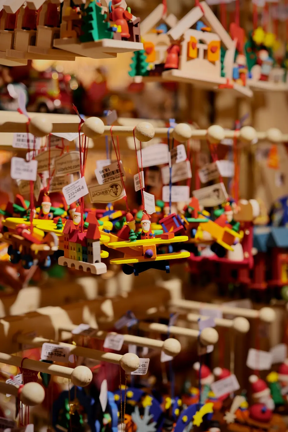 Vibrant handcrafted ornaments displayed at a Christmas market, creating a joyful holiday atmosphere.